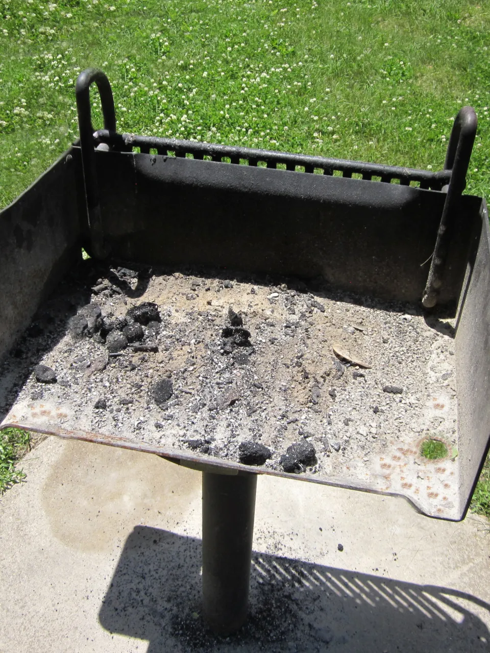 outdoor grill with a rusty firebox