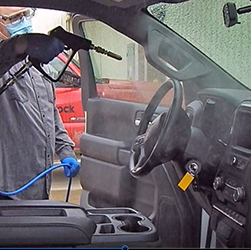 DMS-TNT350 Disinfecting Mister used in vehicle cab.